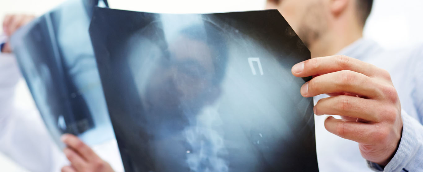 Clinician reviewing an X-ray