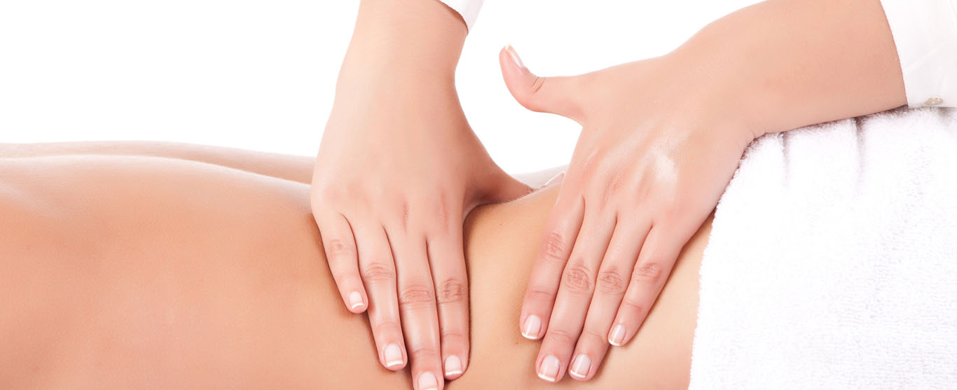 Hands massaging a patient’s back